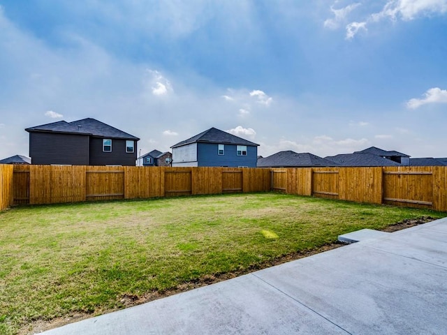 view of yard featuring a patio and a fenced backyard