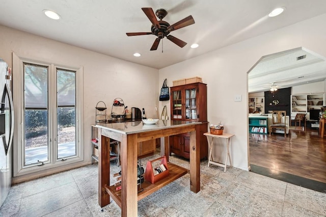 home office with recessed lighting, a ceiling fan, and arched walkways