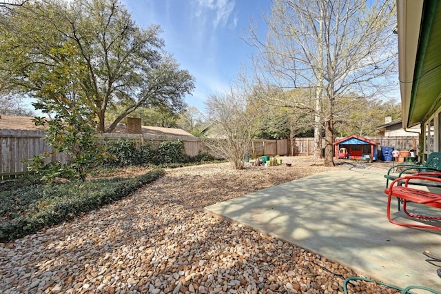 view of yard with a patio and a fenced backyard