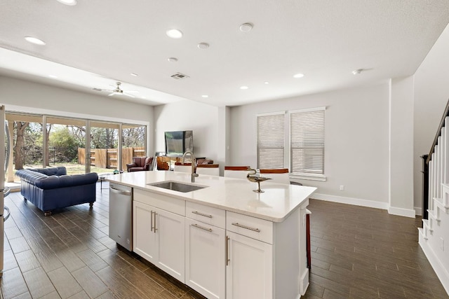 1050 Kenney Fort Xing Unit 24, Round Rock, TX 78665 - kitchen featuring stainless steel dishwasher, open floor plan, a sink, dark wood-style flooring, and recessed lighting