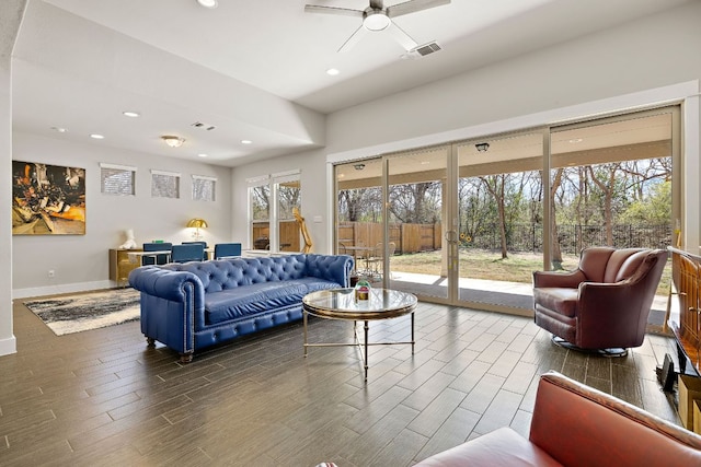 living area with visible vents, recessed lighting, a ceiling fan, and wood finished floors