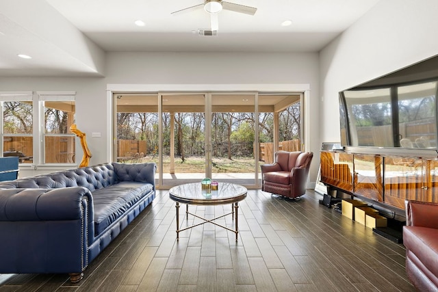 living area with recessed lighting, visible vents, dark wood-type flooring, and a ceiling fan