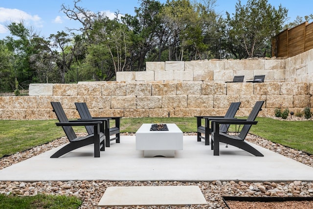 view of patio / terrace featuring a fire pit and fence