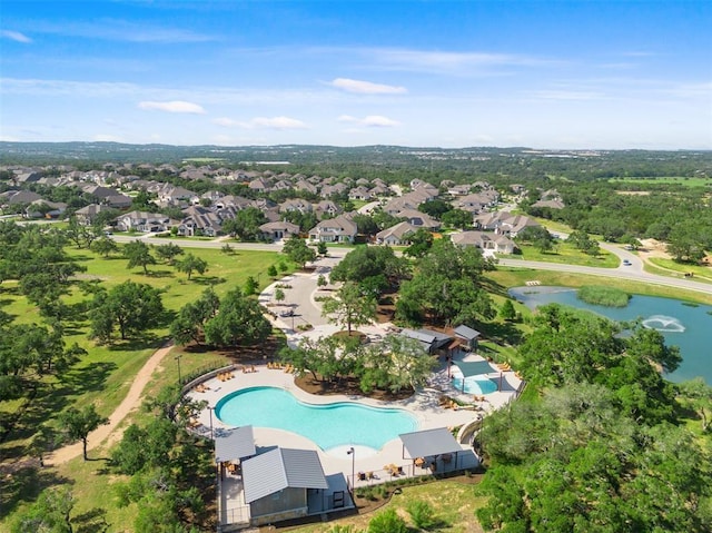 drone / aerial view with a residential view and a water view