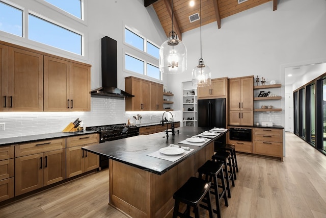 kitchen featuring black appliances, open shelves, dark countertops, wall chimney range hood, and wood ceiling