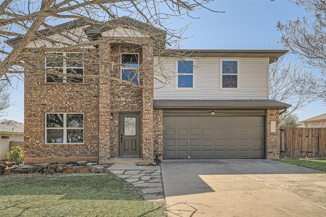 traditional-style house featuring brick siding, driveway, an attached garage, and fence