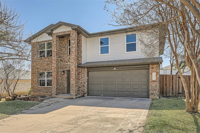 traditional-style house with a garage, brick siding, concrete driveway, and fence