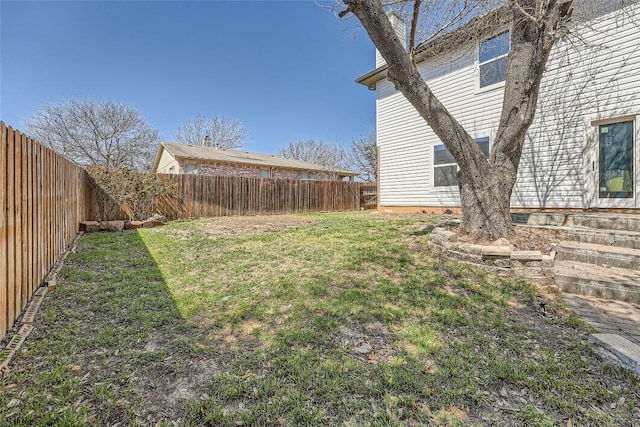 view of yard featuring a fenced backyard