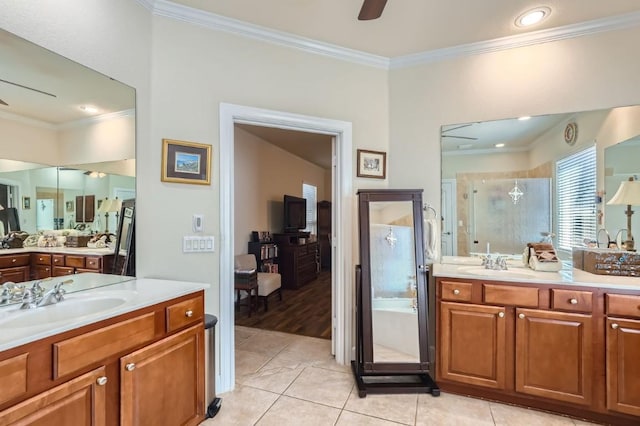 bathroom featuring tile patterned flooring, a stall shower, ceiling fan, and a sink