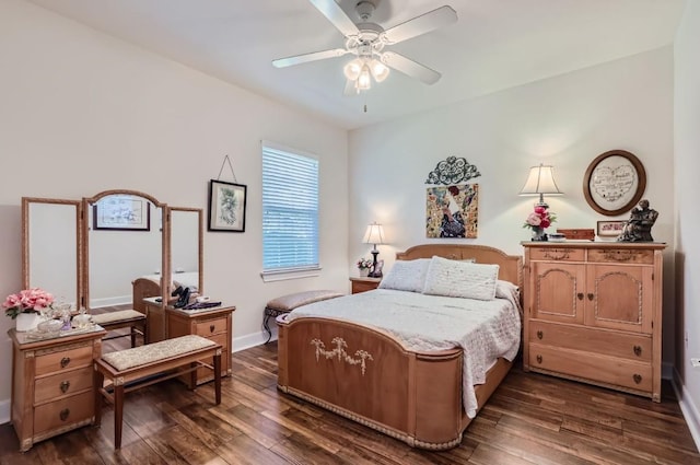 bedroom featuring dark wood-style floors, baseboards, and ceiling fan