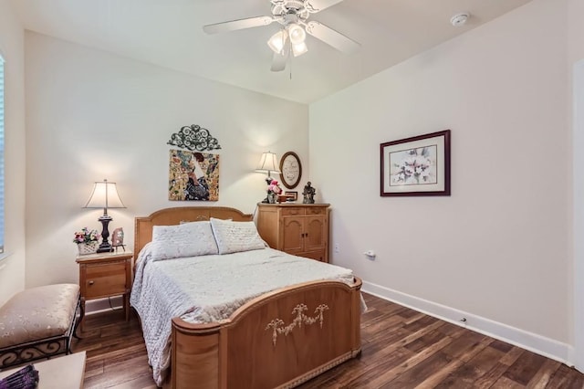 bedroom featuring ceiling fan, baseboards, and dark wood-style floors