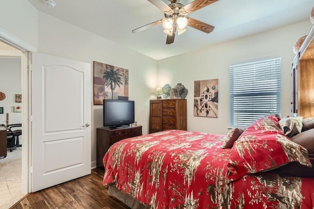 bedroom featuring a ceiling fan and wood finished floors