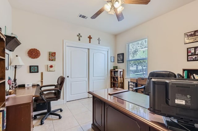 office area with light tile patterned floors, visible vents, and a ceiling fan