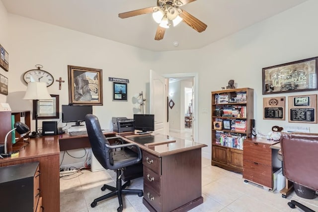 home office featuring light tile patterned floors and a ceiling fan