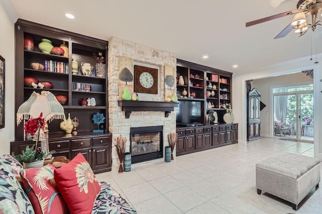 living room with recessed lighting, a stone fireplace, ceiling fan, and light tile patterned flooring