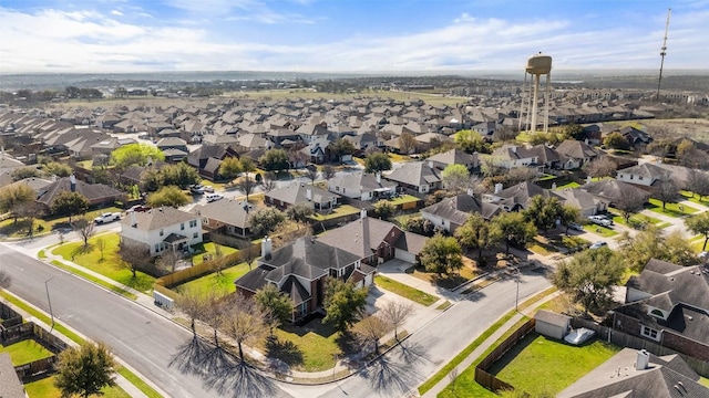 birds eye view of property with a residential view