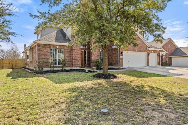 view of front of house featuring fence, driveway, an attached garage, a front lawn, and brick siding