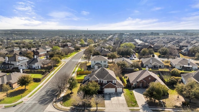 birds eye view of property with a residential view