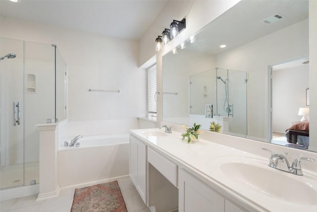 bathroom with a stall shower, a bath, visible vents, and a sink