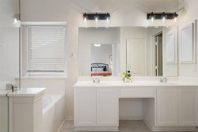 bathroom with a sink, a garden tub, ensuite bath, and double vanity