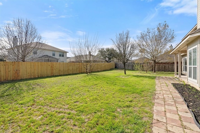 view of yard featuring a fenced backyard