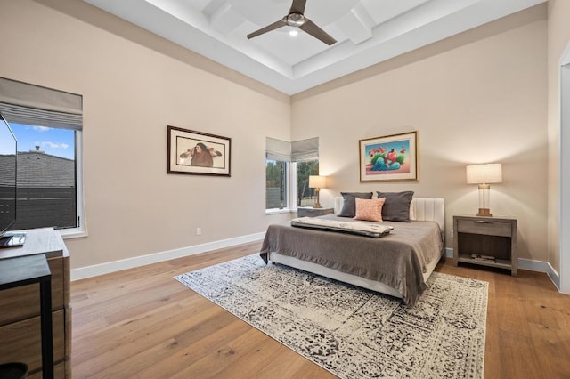 316 Duckhorn Pass, Austin, TX 78738 - bedroom featuring hardwood / wood-style flooring, coffered ceiling, beamed ceiling, and a ceiling fan