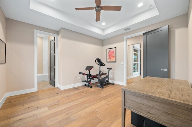 316 Duckhorn Pass, Austin, TX 78738 - exercise area featuring light wood-style floors, a raised ceiling, recessed lighting, and a ceiling fan