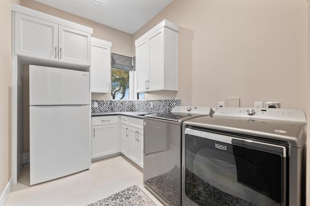 316 Duckhorn Pass, Austin, TX 78738 - laundry area with separate washer and dryer, cabinet space, and light tile patterned flooring