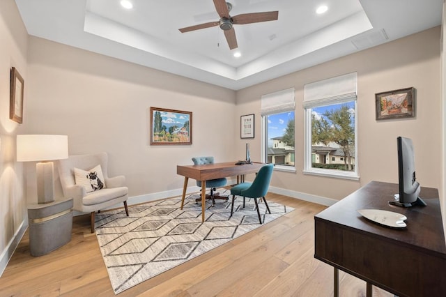 316 Duckhorn Pass, Austin, TX 78738 - office space featuring a tray ceiling, ceiling fan, recessed lighting, and light wood-style floors