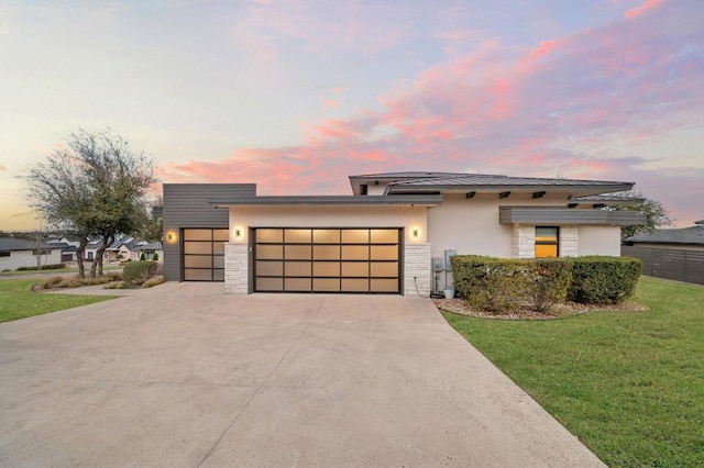 316 Duckhorn Pass, Austin, TX 78738 - view of front facade featuring a garage, stucco siding, driveway, a front lawn, and stone siding