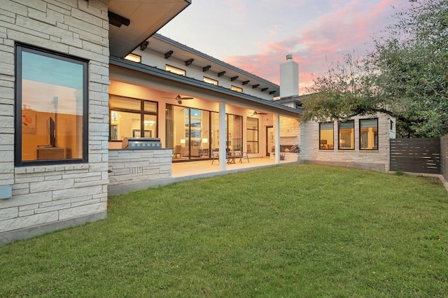 316 Duckhorn Pass, Austin, TX 78738 - back of property with a patio area, ceiling fan, and stone siding