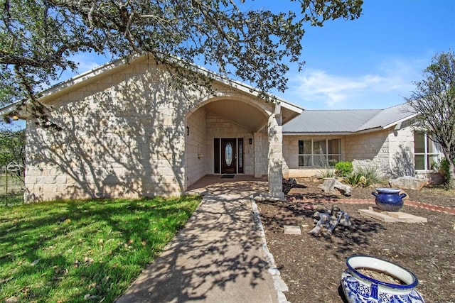 25048 River Rd, Spicewood, TX 78669 - ranch-style home featuring concrete block siding and a metal roof