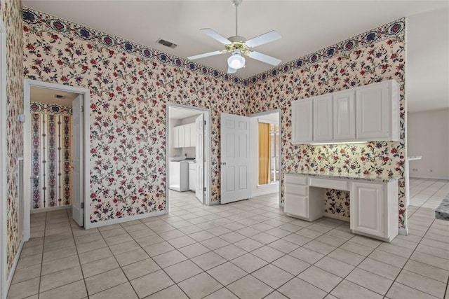 25048 River Rd, Spicewood, TX 78669 - unfurnished room featuring wallpapered walls, ceiling fan, and light tile patterned floors
