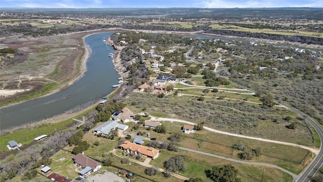 25048 River Rd, Spicewood, TX 78669 - aerial overview of property's location with a large body of water and nearby suburban area