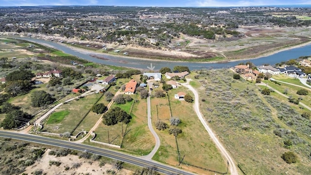 25048 River Rd, Spicewood, TX 78669 - aerial view of property and surrounding area with a large body of water and nearby suburban area