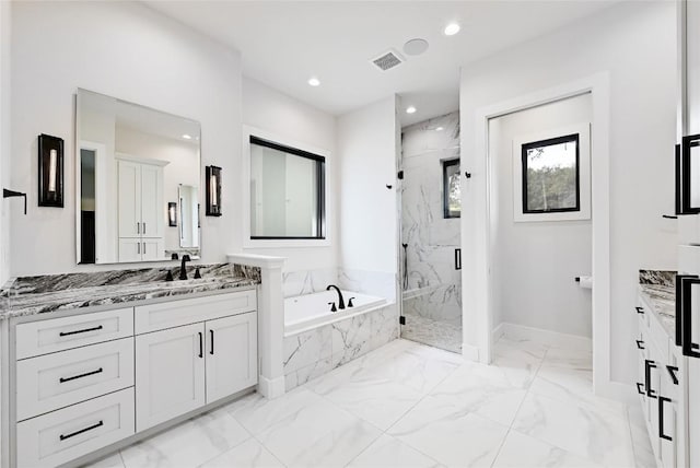 full bathroom with vanity, a bath, marble finish floor, and a marble finish shower