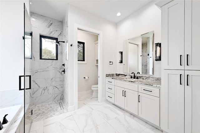 full bathroom with a marble finish shower, toilet, a bath, marble finish floor, and vanity