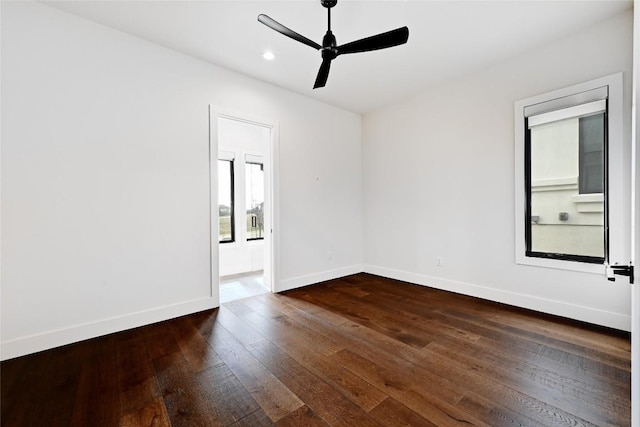 empty room featuring recessed lighting, baseboards, dark wood-style floors, and a ceiling fan