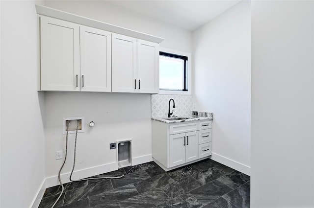 laundry area featuring hookup for a washing machine, baseboards, hookup for an electric dryer, cabinet space, and hookup for a gas dryer