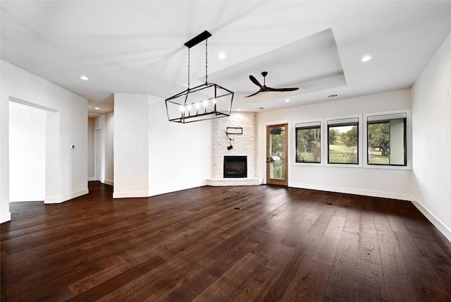 unfurnished living room featuring dark wood finished floors, recessed lighting, baseboards, and ceiling fan