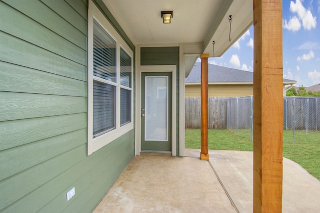 view of patio featuring fence