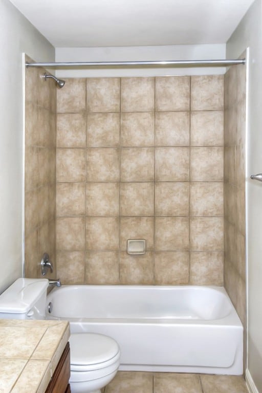 full bath featuring tile patterned flooring, vanity, toilet, and shower / bathing tub combination