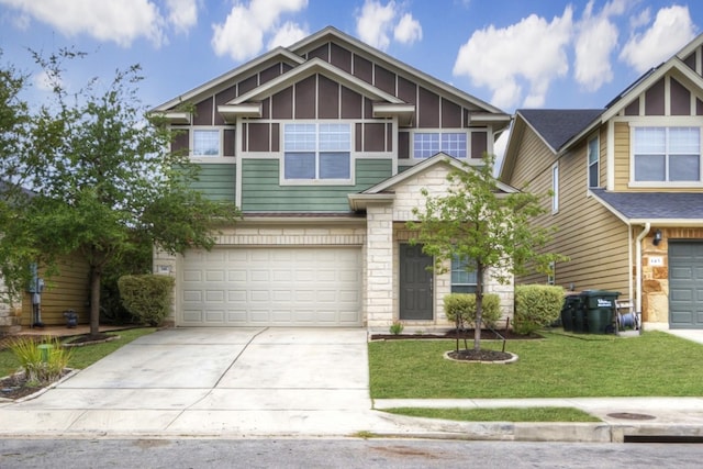 view of front facade with a garage, concrete driveway, and a front lawn