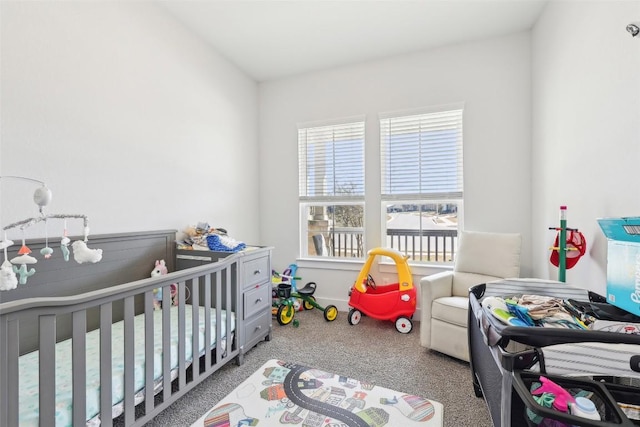 bedroom with a crib and carpet