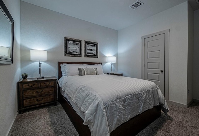 carpeted bedroom with visible vents and baseboards