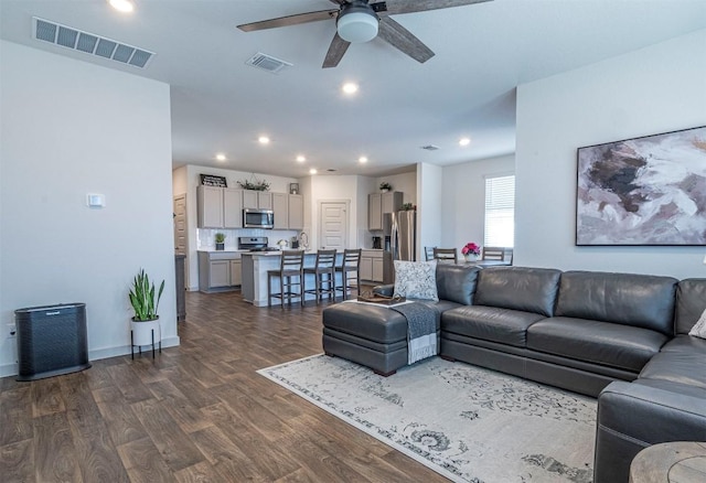 208 Greens Bayou Trl, Hutto, TX 78634 - living area with ceiling fan, dark wood-style floors, and recessed lighting