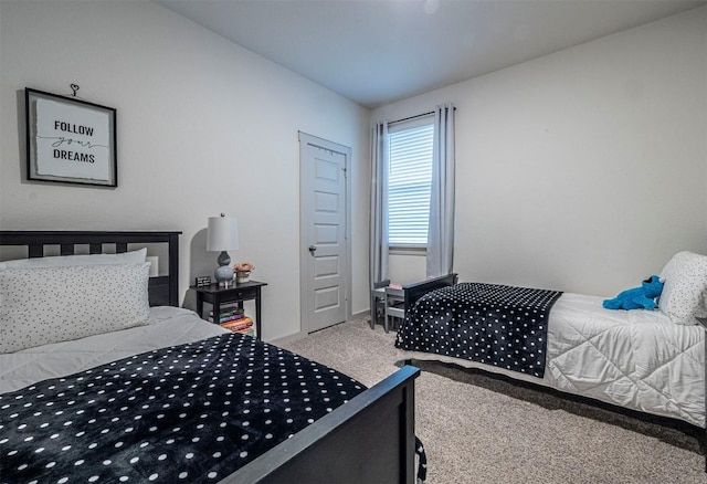 carpeted bedroom with baseboards