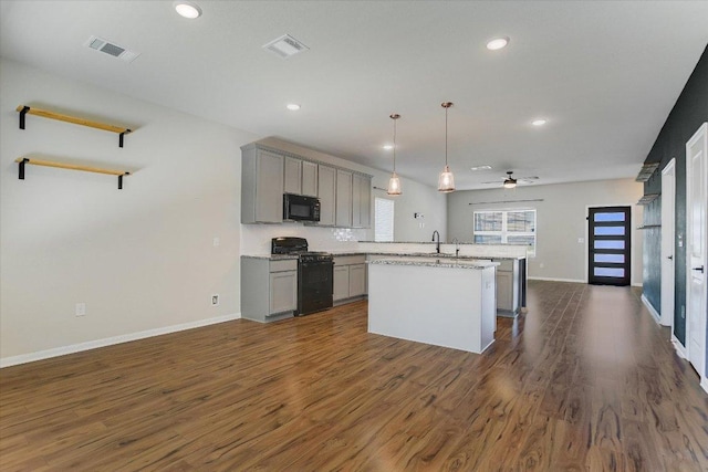 kitchen featuring black appliances, gray cabinets, baseboards, dark wood-style floors, and recessed lighting