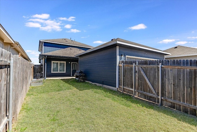 back of property featuring roof with shingles