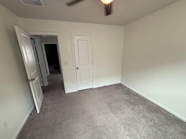 300 Eagle Lake Dr, Hutto, TX 78634 - unfurnished bedroom featuring dark carpet and baseboards